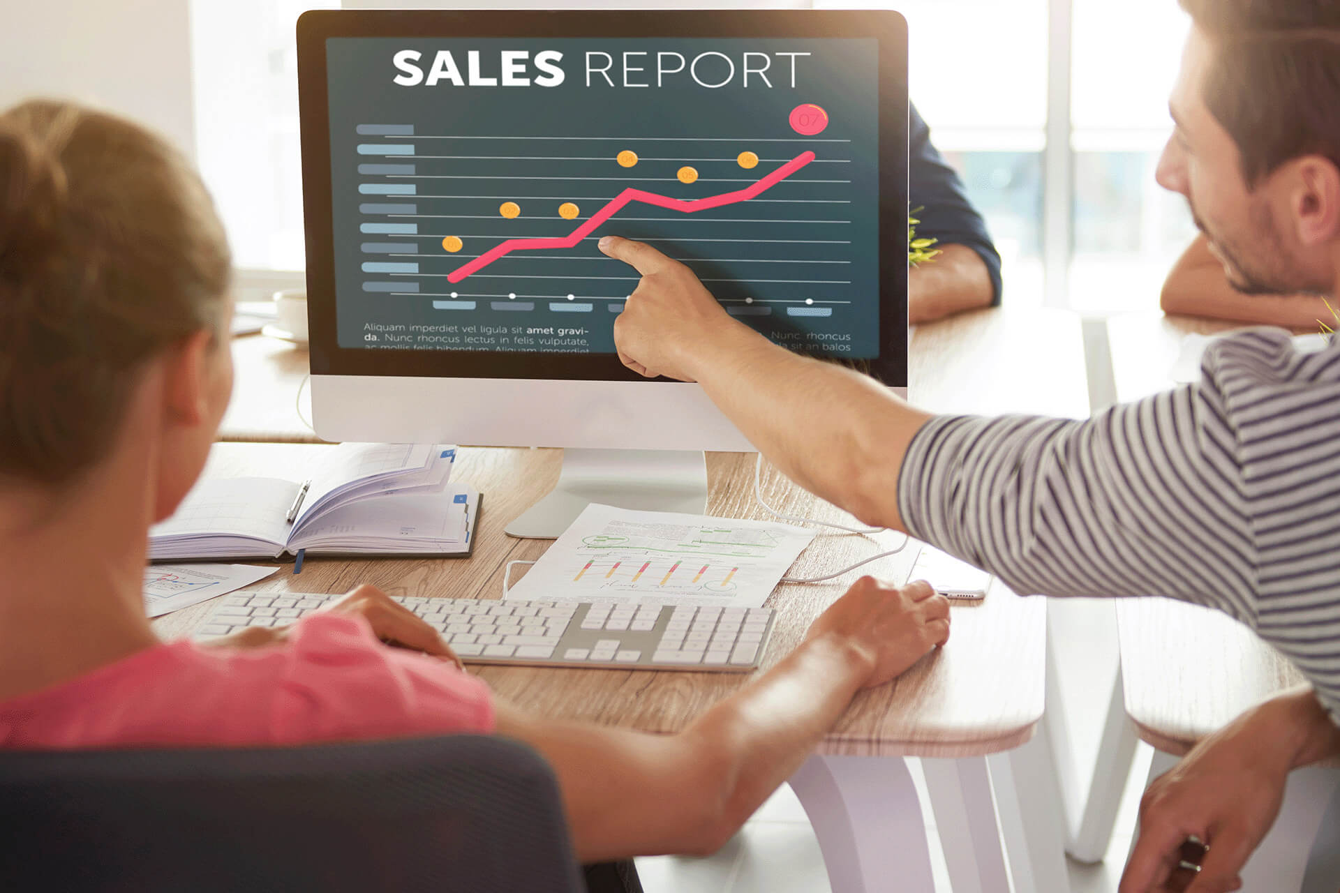 Workers looking at sales report in live chat system Workers looking at sales report in live chat system